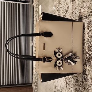 Kate Spade black and tan bag with owl keychain included.